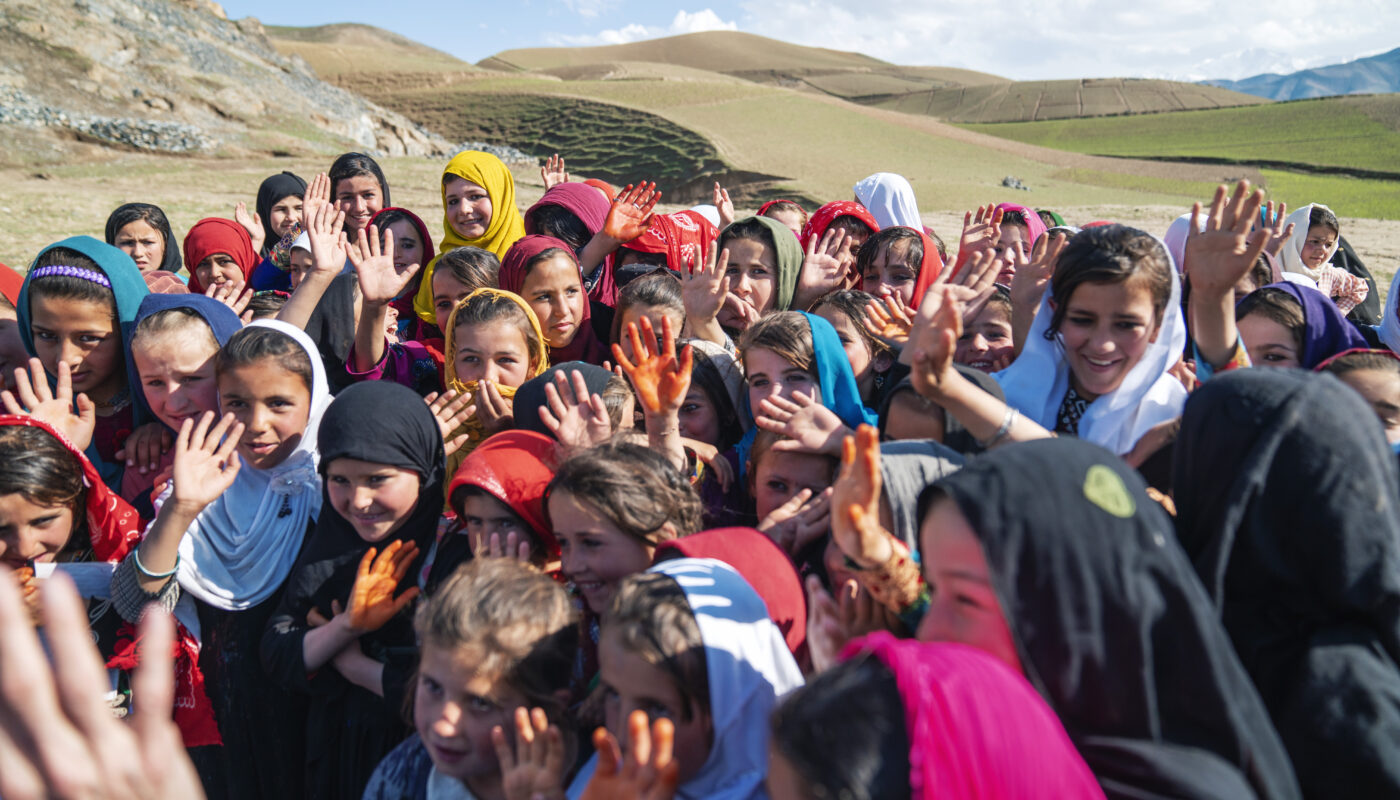 Children while playing in the backyard of their school located in Wakil Abad village, Faizabad city, Badakhshan province, Afghanistan.
UNHCR supported, the installation of Refugee Housing Units (RHUs) in Wakil Abad School to provide enough space for students to learn. ; When families, displaced many times due to conflict,  arrived in one area in Faizabad district, Afghanistan, asking for  help to create a village and settle down, UNHCR and partners stepped in to provide support  with improved  access to essential services, to prevent further displacement and build community resilience.  So far, work has included  building a water network, a well, shelters, a community centre, supporting the construction of a road and providing livelihood projects. Now Wakil Abad village, located in one of UNHCR’s Priority Areas of Return and Reintegration (PARRs), in north-eastern Badakshan, is becoming a thriving village of more than 100 families.